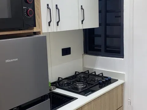 Kitchen with cooker and worktop