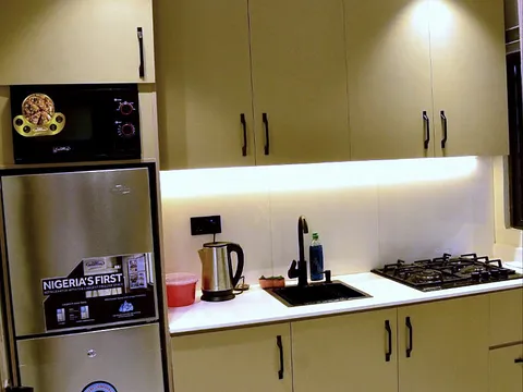 Kitchen with cooker and worktop