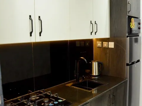Kitchen with cooker and worktop